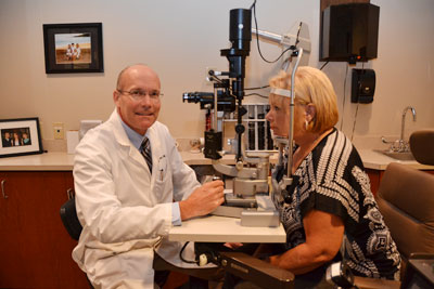 Dr. Leinfelder with a patient.